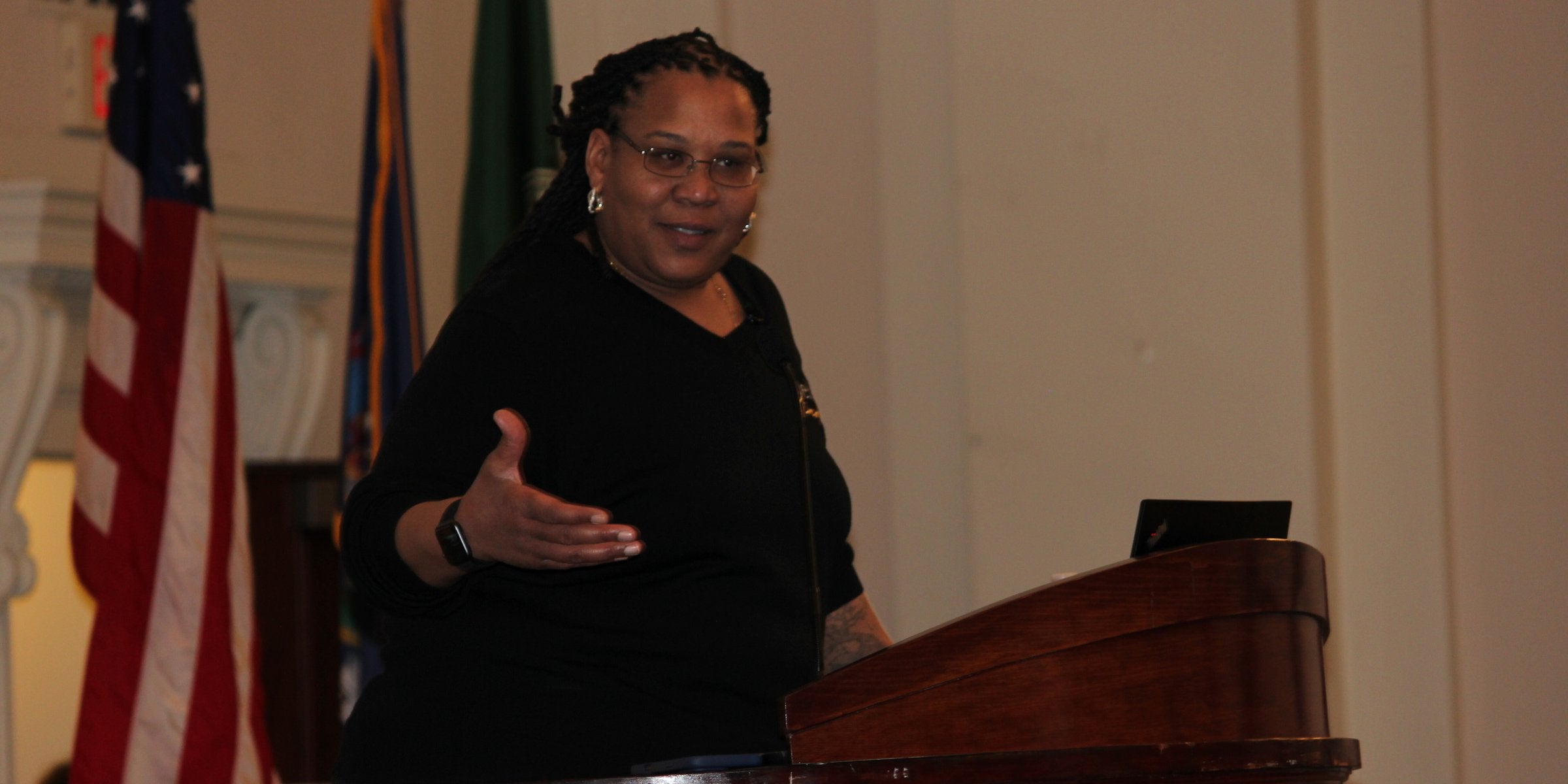 Dr. Ebony I. Green speaking from a podium